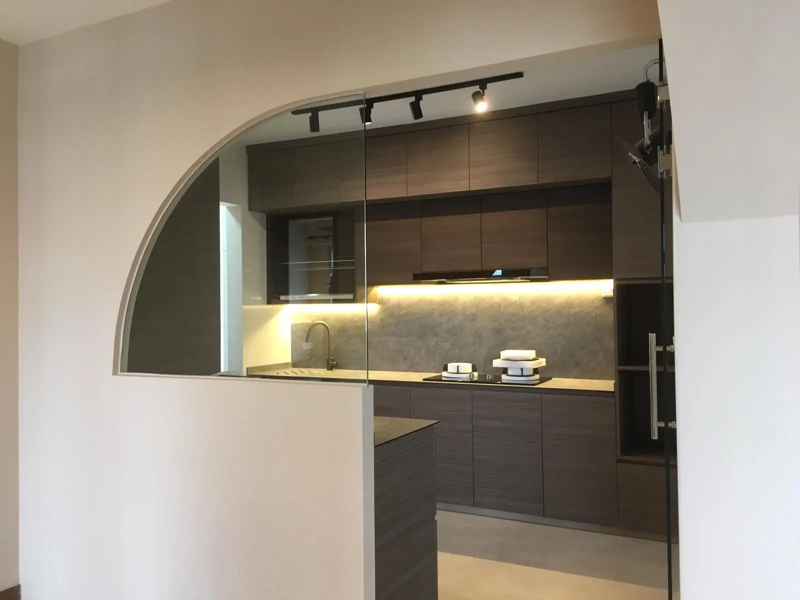 HDB Renovation of a Modern kitchen design with glass view.