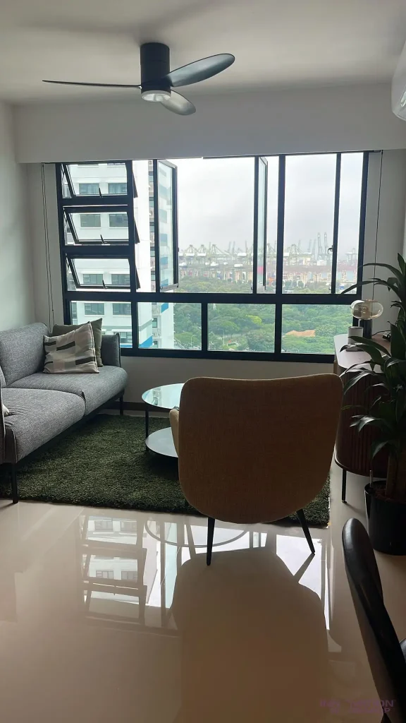 Condo renovation West Coast – living room with grey sofa and full-height windows