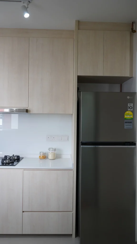 HDB renovation Woodlands – kitchen cabinets with fridge recess and overhead storage