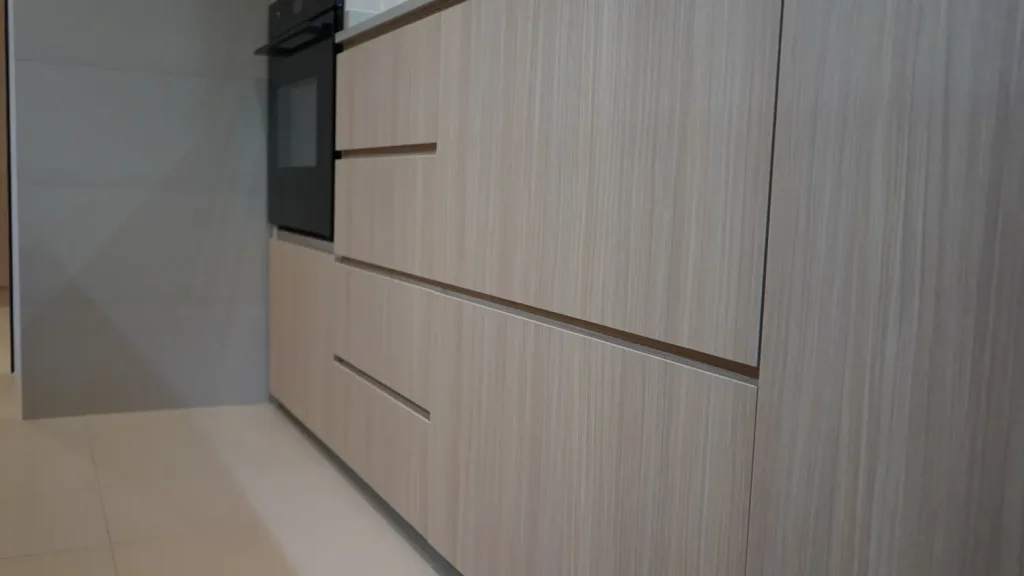 HDB renovation Telok Blangah – kitchen cabinetry with handleless doors and built-in oven