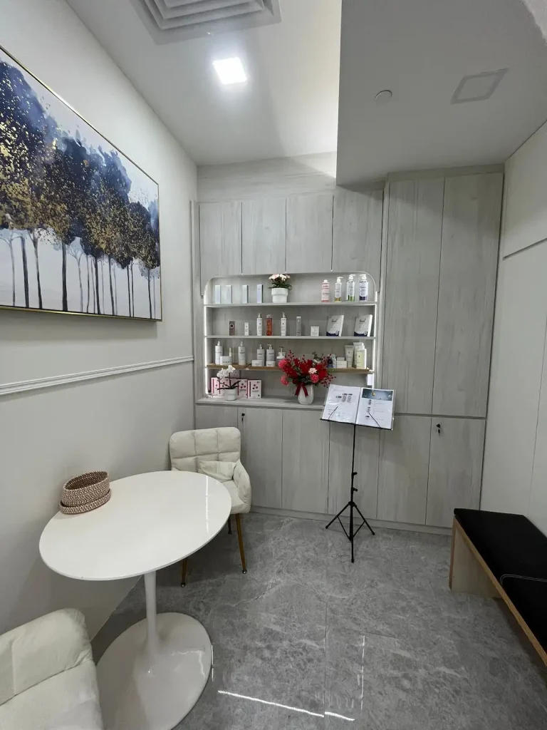 Beauty salon renovation Sengkang – retail product display niche with arched LED shelves and storage cabinets