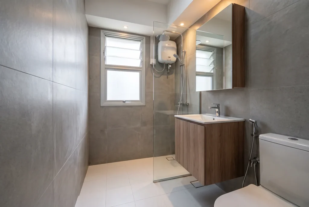 Illustration - renovated HDB bathroom with glass shower screen and floating vanity