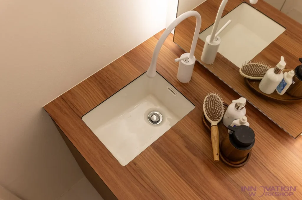 Beauty salon renovation Pasir Ris – timber-look vanity top with undermount basin and mirror