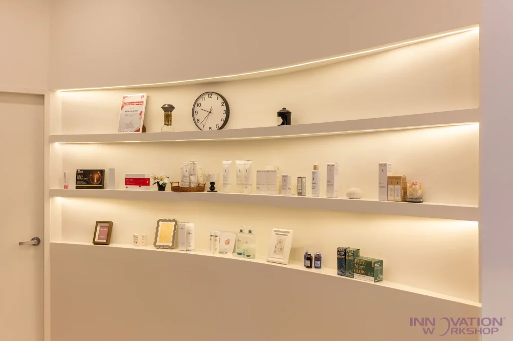 Beauty salon renovation Pasir Ris – curved wall niche shelving with LED strip lighting